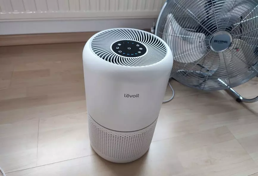 air purifier levoit core next to floor fan