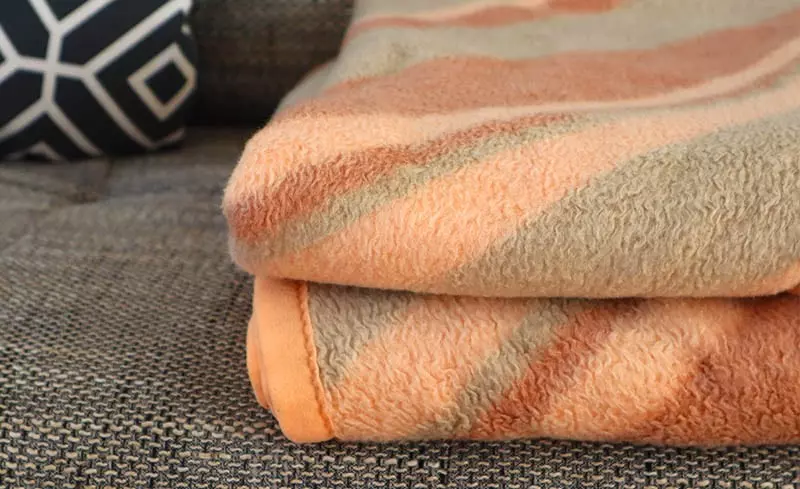 blanket on couch - better than a space heater?