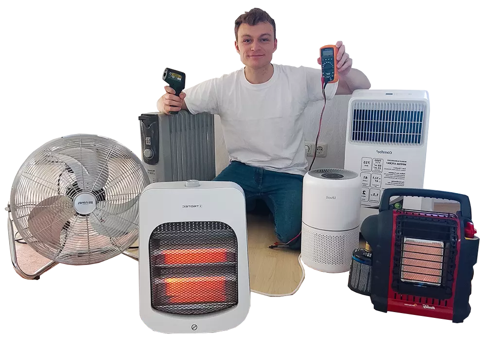 the author sitting on the floor with space heaters, an air conditioner, a fan, and an air purifier