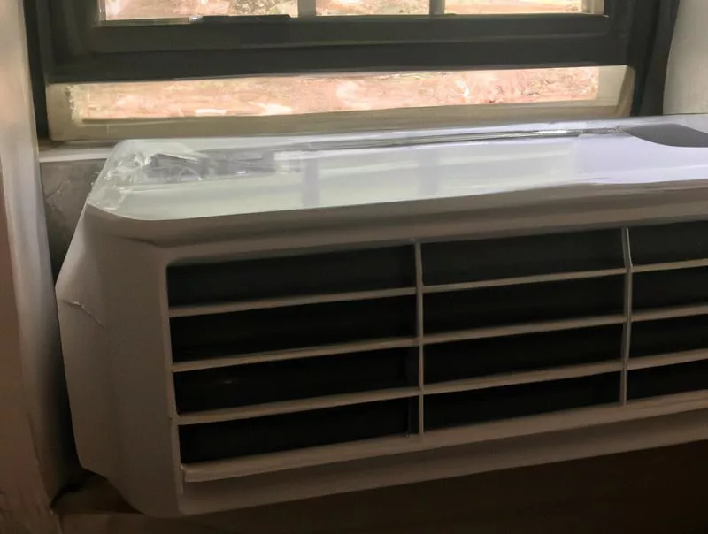 window AC at bottom of window