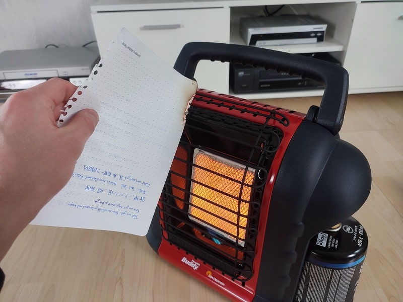 mr heater buddy propane heater burning paper