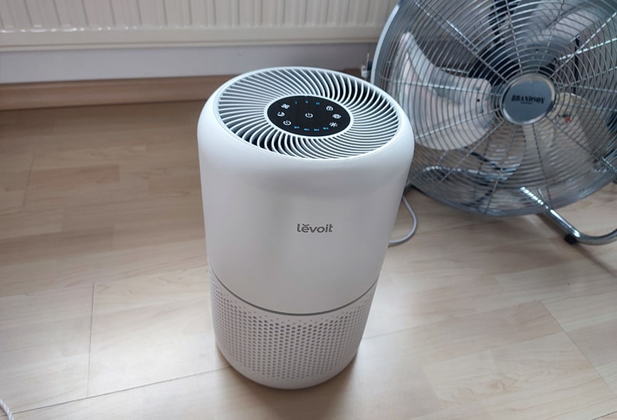 air purifier levoit core next to floor fan